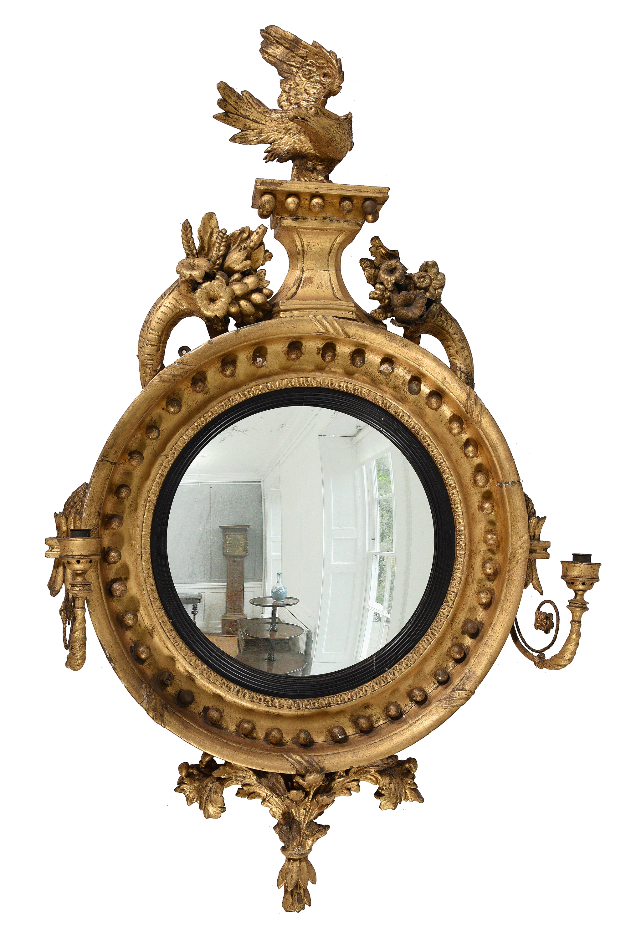 Inline Image - Lot 288: A Regency giltwood and composition convex wall mirror, circa 1815 | Est. £700-1,000 (+ fees)