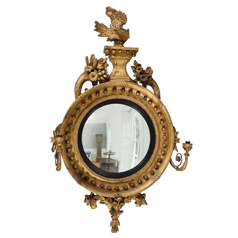 Inline Image - Lot 288: A Regency giltwood and composition convex wall mirror, circa 1815 | Est. £700-1,000 (+ fees)