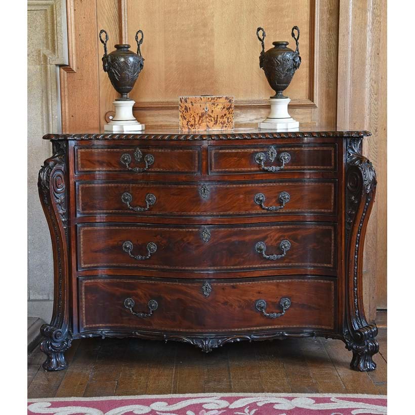 Inline Image - Lot 95: A fine George III mahogany and inlaid serpentine fronted commode, in the manner of William Vile, circa 1765 | Est. £80,000-120,000 (+ fees)