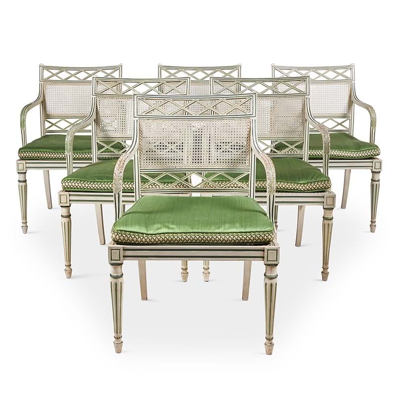 As set of eighteen cream and green painted dining chairs, designed by Oliver Messel, made by Victor Afia