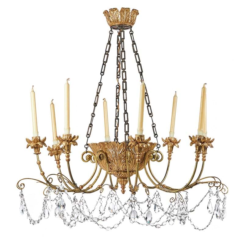 A painted and giltwood and composition eight light chandelier, designed by Oliver Messel