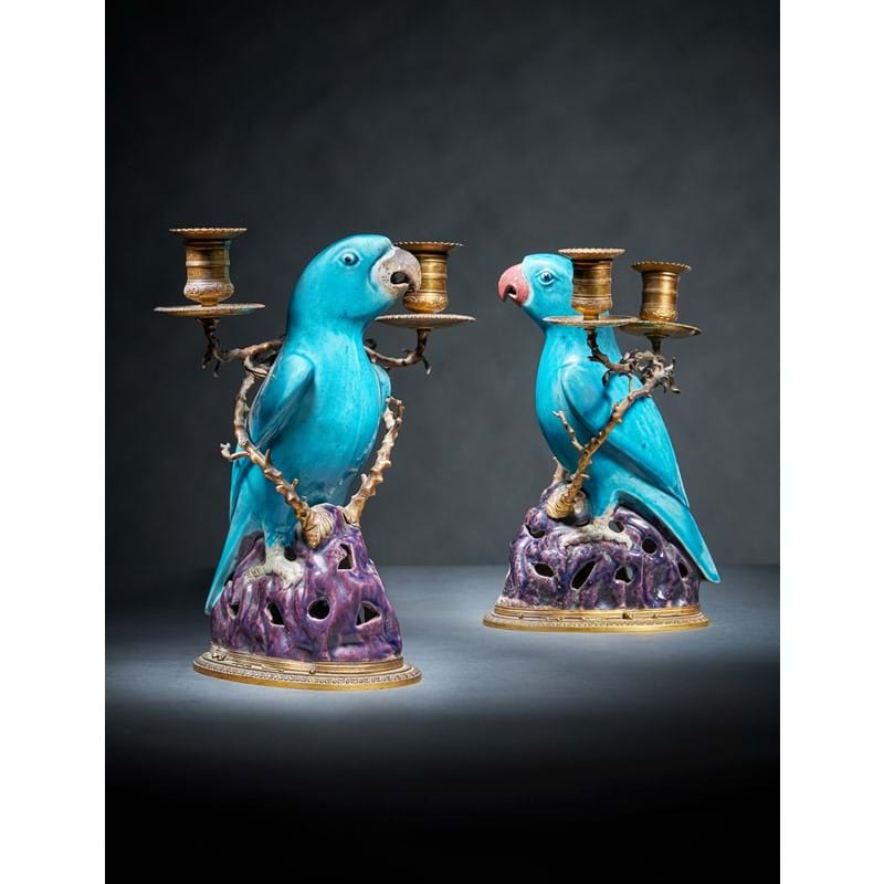 A fine pair of Chinese gilt-metal mounted biscuit porcelain parrot candelabra, the porcelain Kangxi (1662-1722)