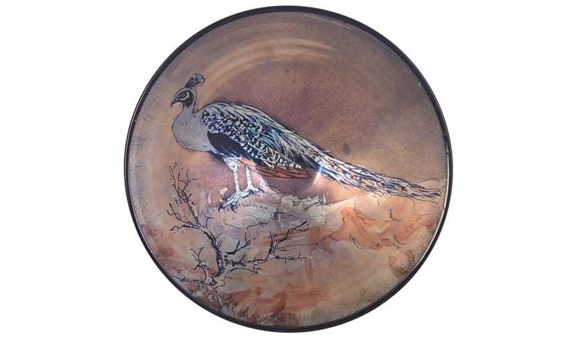 Inline Image - Lot 112: Jonathan Chiswell Jones for JCJ Pottery, a reduction fired lustre porcelain conical bowl, fired June 2022, decorated with a peacock on a rocky ground | Est. £120-180 (+ fees)