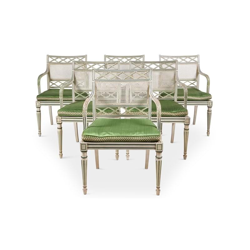 A set of eighteen cream and green painted dining chairs, designed by Oliver Messel, made by Victor Afia