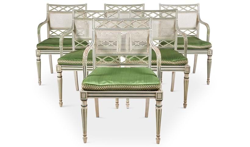 Inline Image - Lot 70: A set of eighteen cream and green painted dining chairs, designed by Oliver Messel, made by Victor Afia | Sold for £30,000