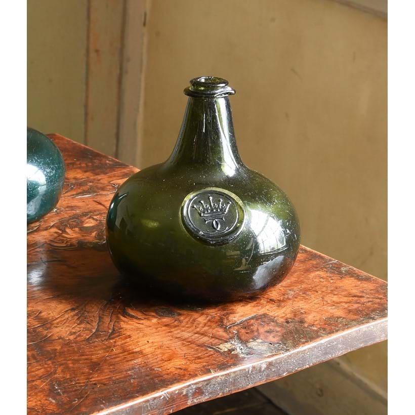 Inline Image - Lot 464: An ‘Onion' shaped olive-green tint sealed wine bottle, early 18th century | Est. £2,000-3,000 (+ fees)