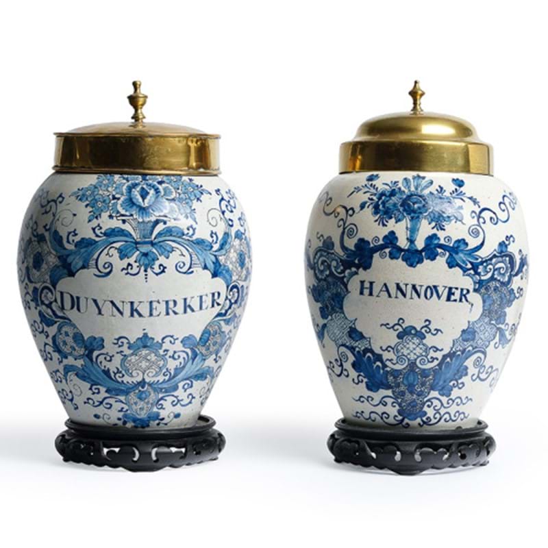 Two similar Dutch Delft Blue and White Tobacco Jars and Associated Brass Covers