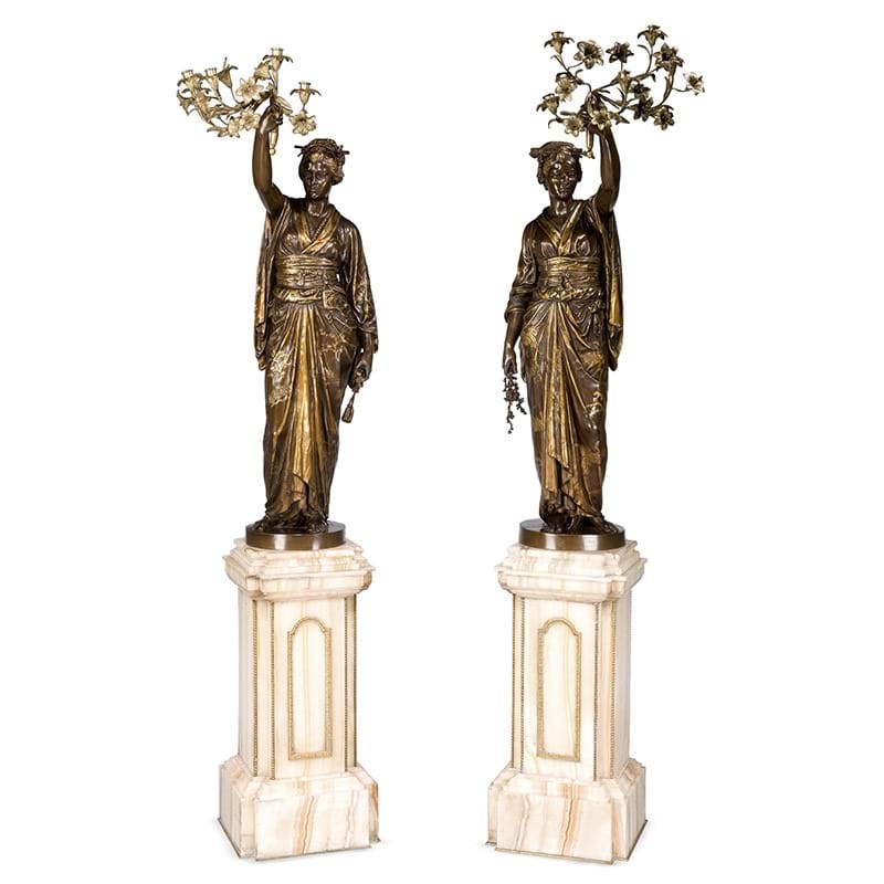 A rare pair of parcel gilt and bronze figural torcheres by Barbedienne and Guillemin, French circa 1870