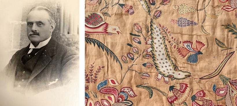 Inline Image - Art and horticultural collector Colonel Stephenson R. Clarke alongside Lot 54, an embroidered carpet with exotic birds, monkeys, butterflies and animals - and possibly a pangolin.