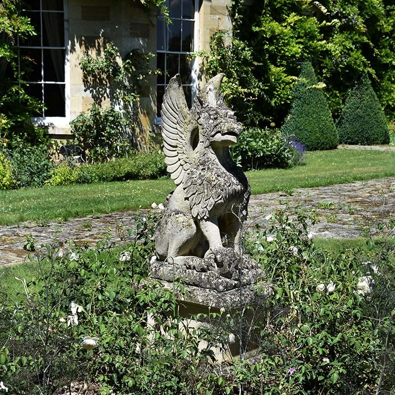 A weathered large stone figure of a griffin, 19th/20th century
