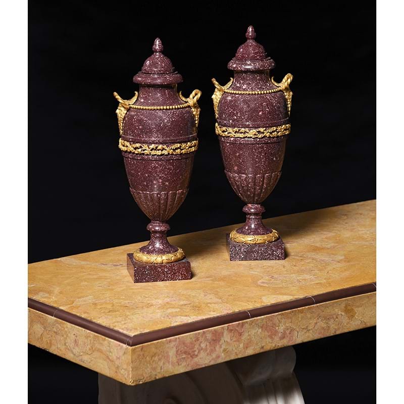 A pair of French porphyry and ormolu mounted urns, circa 1820-1840