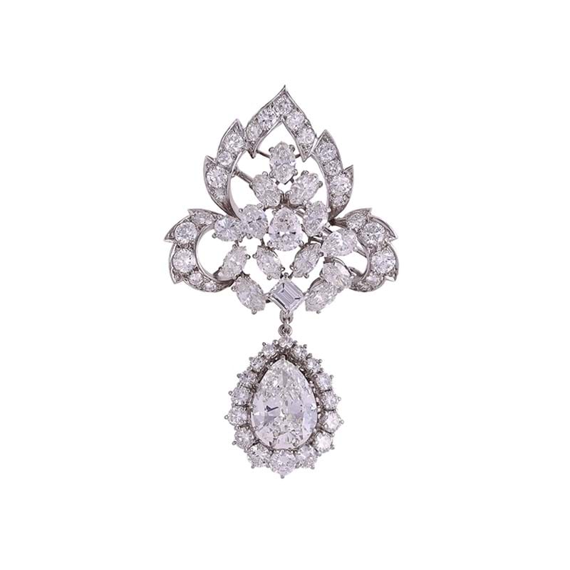 A diamond leaf shaped brooch/pendant with pear cut diamond cluster drop
