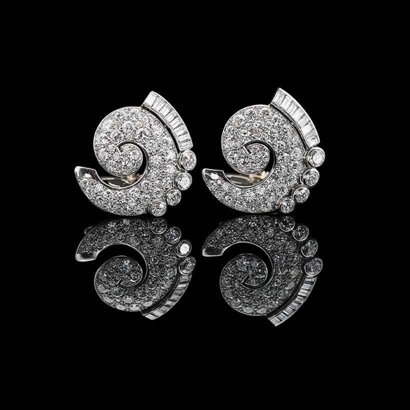 Inline Image - A pair of diamond scrolled clips, Boucheron, Paris, mid-20th century | Est. £6,000-8,000 (+ fees)