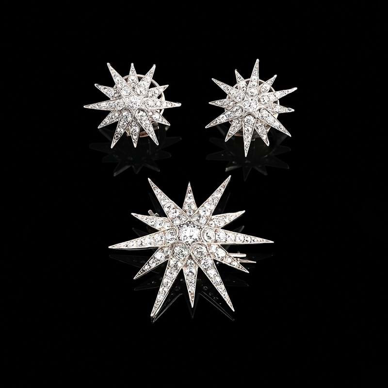 A late Victorian diamond star brooch and pair of ear clips