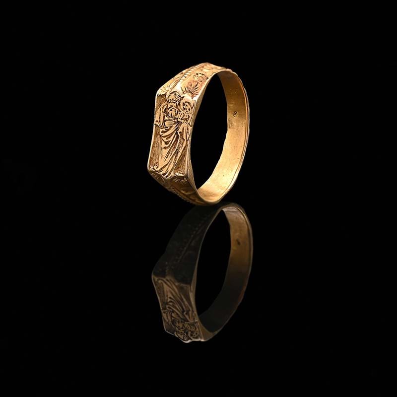 An early 15th century iconographic gold ring, St John the Baptist, circa 1430