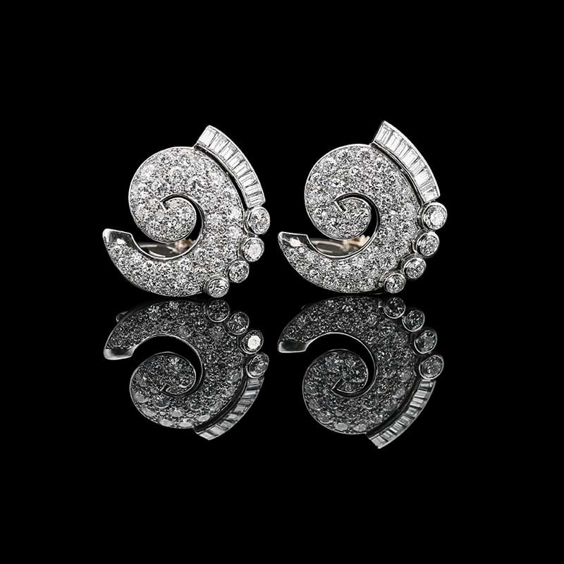 A pair of mid-20th century diamond scrolled clips, Boucheron, Paris