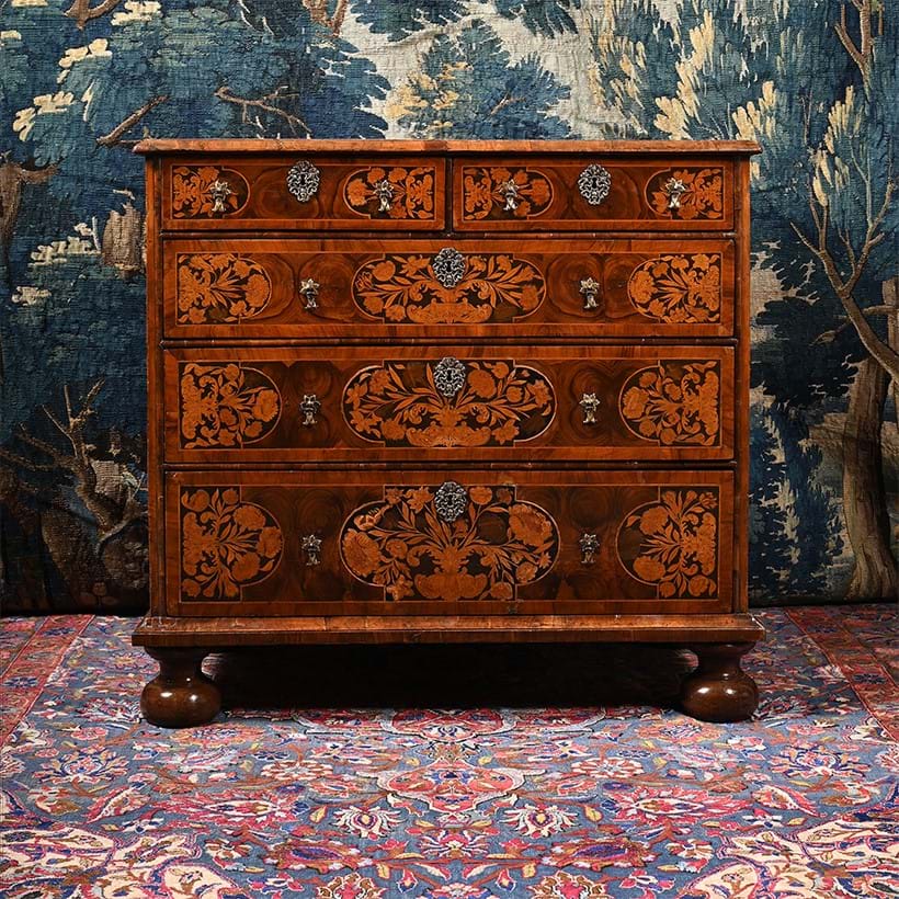 Inline Image - Lot 1: A Charles II olivewood, walnut, fruitwood oyster veneered and floral marquetry chest of drawers, circa 1680 | Est. £6,000-£10,000 (+ fees)