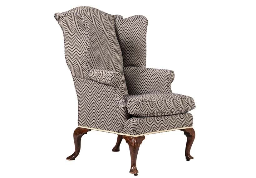 Inline Image - Lot 118: A George II walnut and upholstered wing armchair, circa 1740 and recently upholstered | Est. £1,000-1,500 (+ fees)