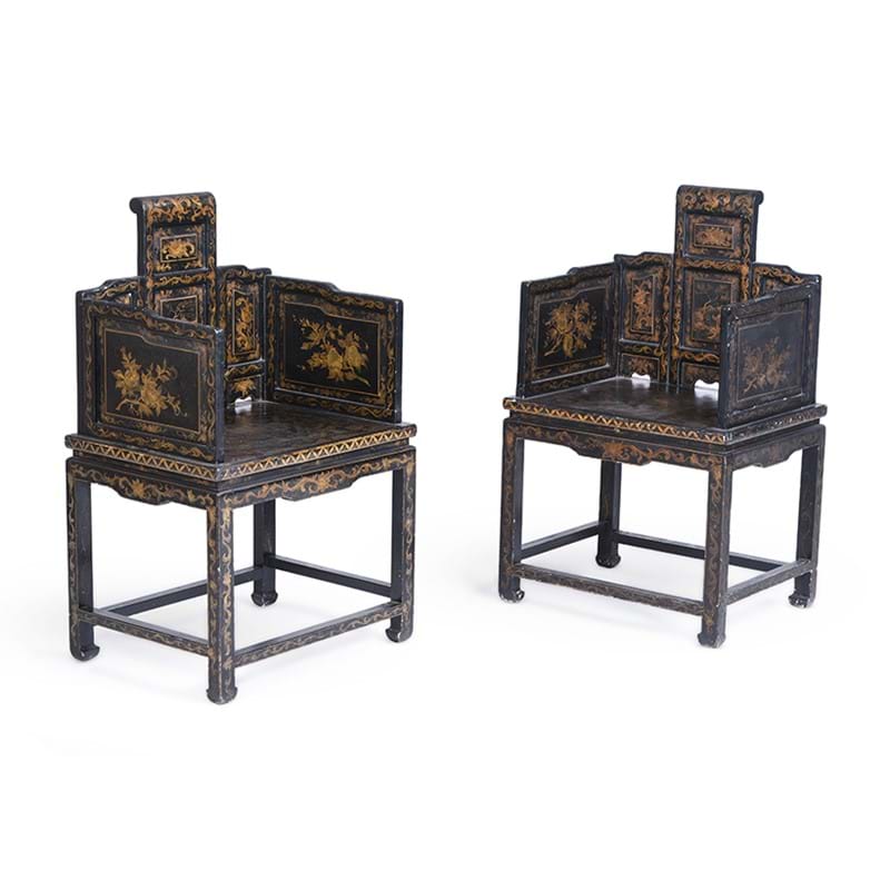 A pair of Chinese black and gilt armchairs, 20th century