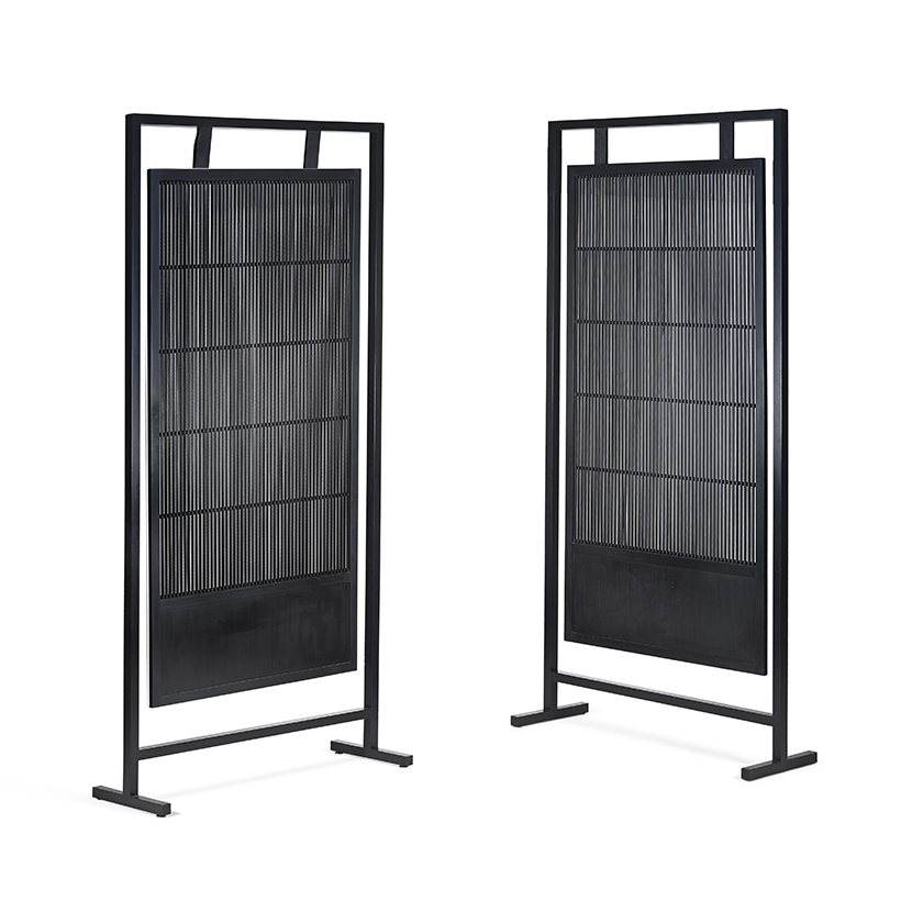 A pair of ebonised room screens, by Anouska Hempel