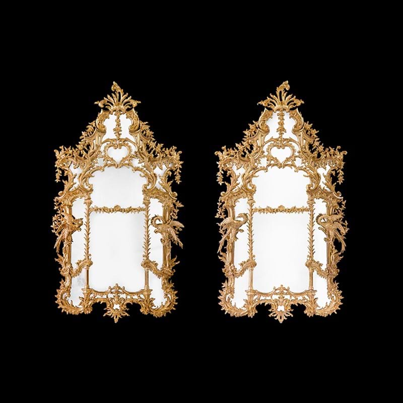 A pair of monumental carved giltwood pier mirrors, 19th century