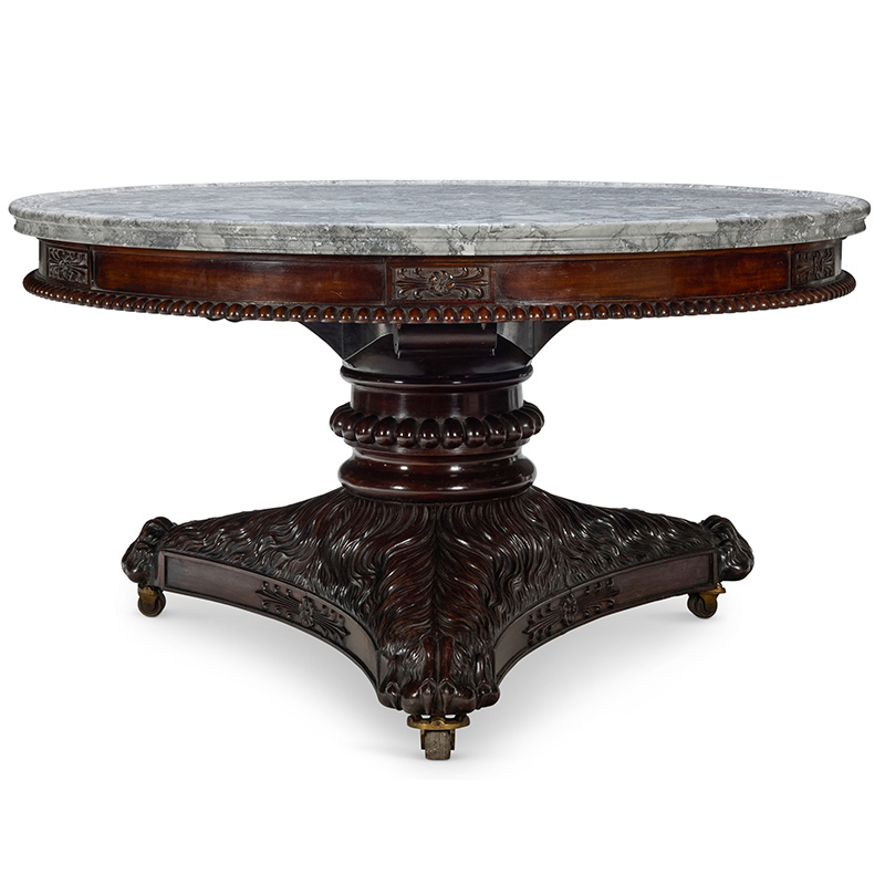 A regency carved mahogany circular centre table, circa 1820