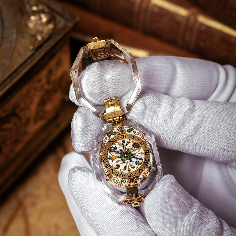 An important Charles I gold and champleve enamel mounted rock crystal pre-hairspring pendant watch, John Snow, Salisbury, circa 1625-30