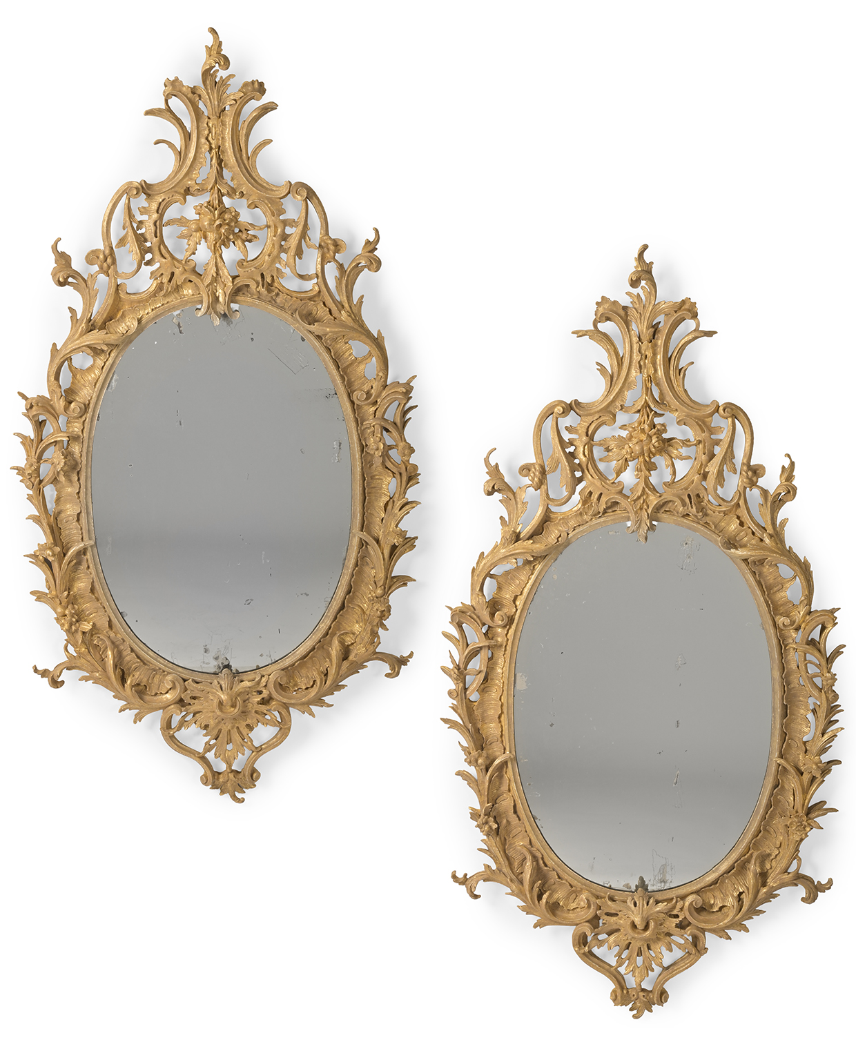 104 A LARGE PAIR OF CARVED GILTWOOD MIRRORS, CIRCA 1780 AND LATER