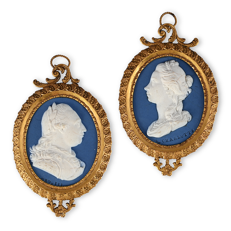 A pair of Wedgwood & Bentley pale-blue solid Jasper oval plaques of their majesties King George III and Queen Charlotte modelled by William Hackwood circa 1775