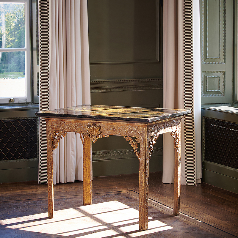 A pair of carved giltwood, Gesso, black lacquer and chinoiserie decorated console tables