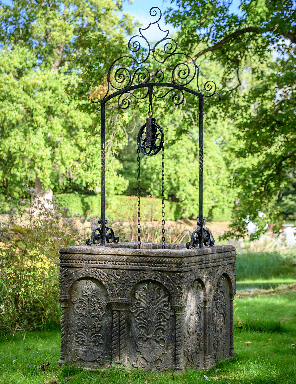 515 AN ITALIAN ROSSO VERONA MARBLE AND WROUGHT IRON WELL HEAD, IN VENETO BYZANTINE STYLE, CIRCA 1930