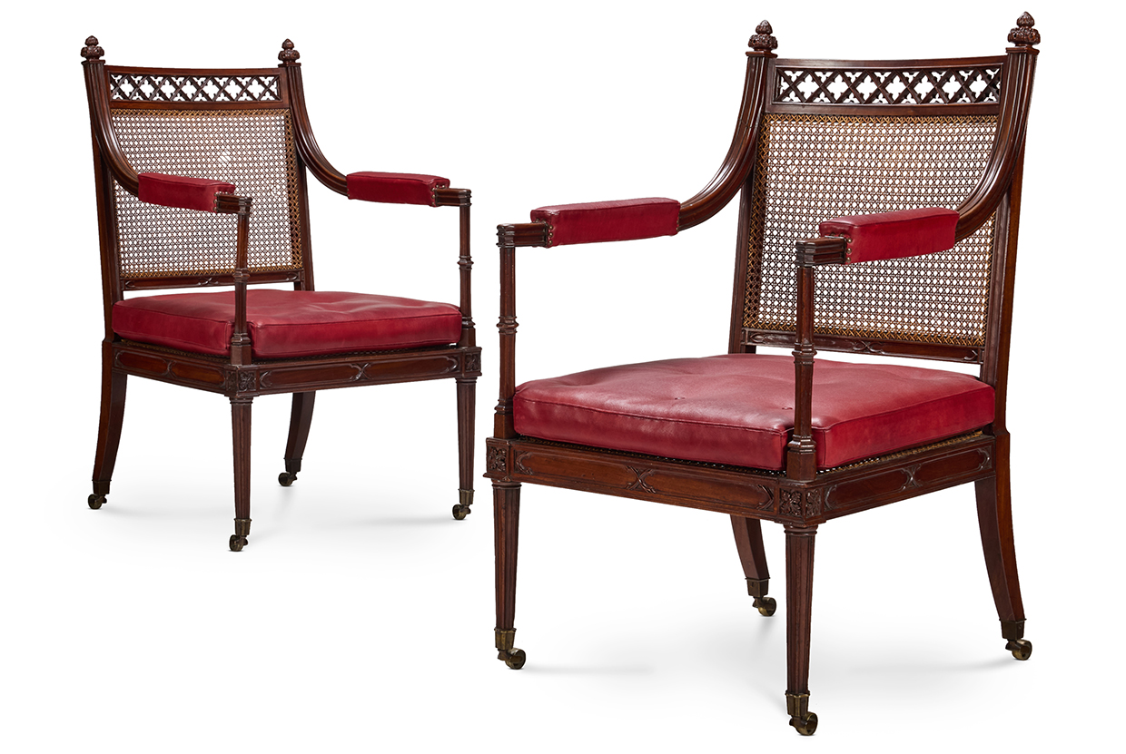 Lot 33 A PAIR OF GEORGE III GOTHIC MAHOGANY AND CANED LIBRARY ARMCHAIRS, CIRCA 1790, ATTRIBUTED TO GILLOWS