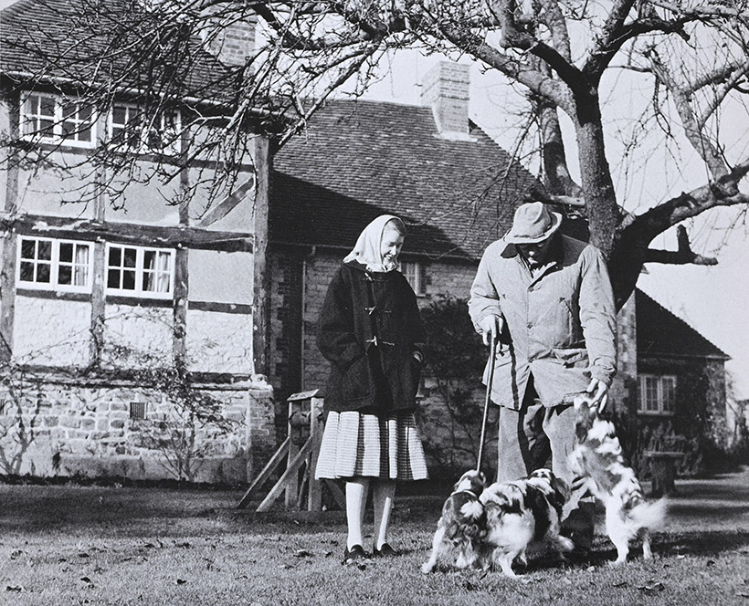 Jessie And Paul In Front Of Their House With Their Three King Charles Spaniels