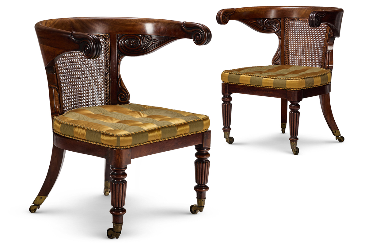 Lot 28 A MATCHED PAIR OF REGENCY MAHOGANY AND CANED 'KLISMOS' LIBRARY ARMCHAIRS, CIRCA 1820
