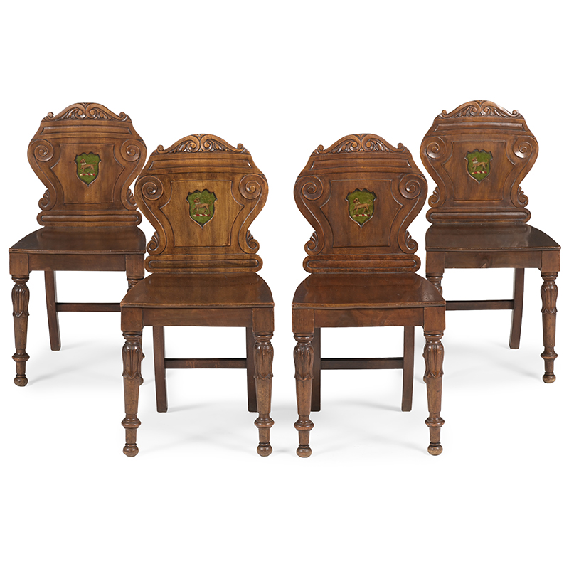 Four William IV mahogany armorial hall chairs, circa 1830