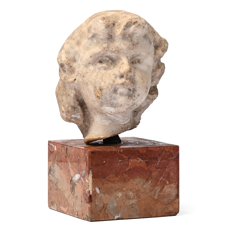 A small marble head of a boy, late 17th century
